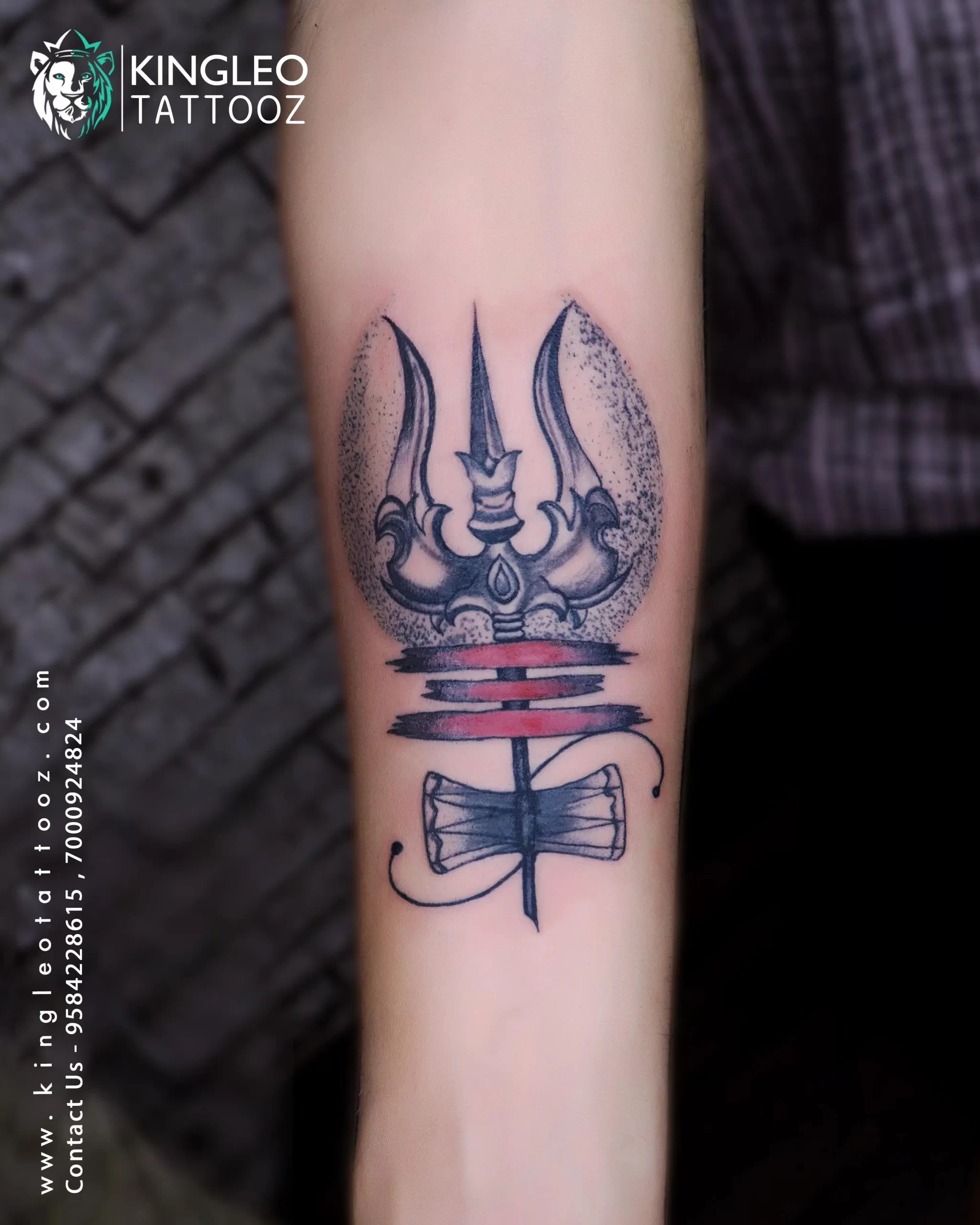 181 Tattooz Studio - A small design of Trishul with damroo on wrist with  slight shading in damroo. One of the best small tattoo designs of Trishul  one can get inked. For